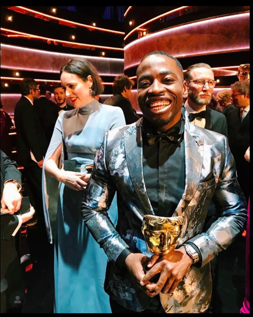 Vic Santoro holding his BAFTA award